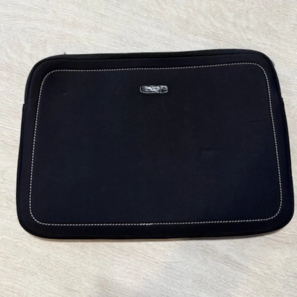 Tumi laptop sleeve.